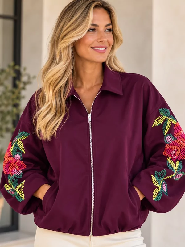Jas in aubergine met bloemen borduur op de mouw